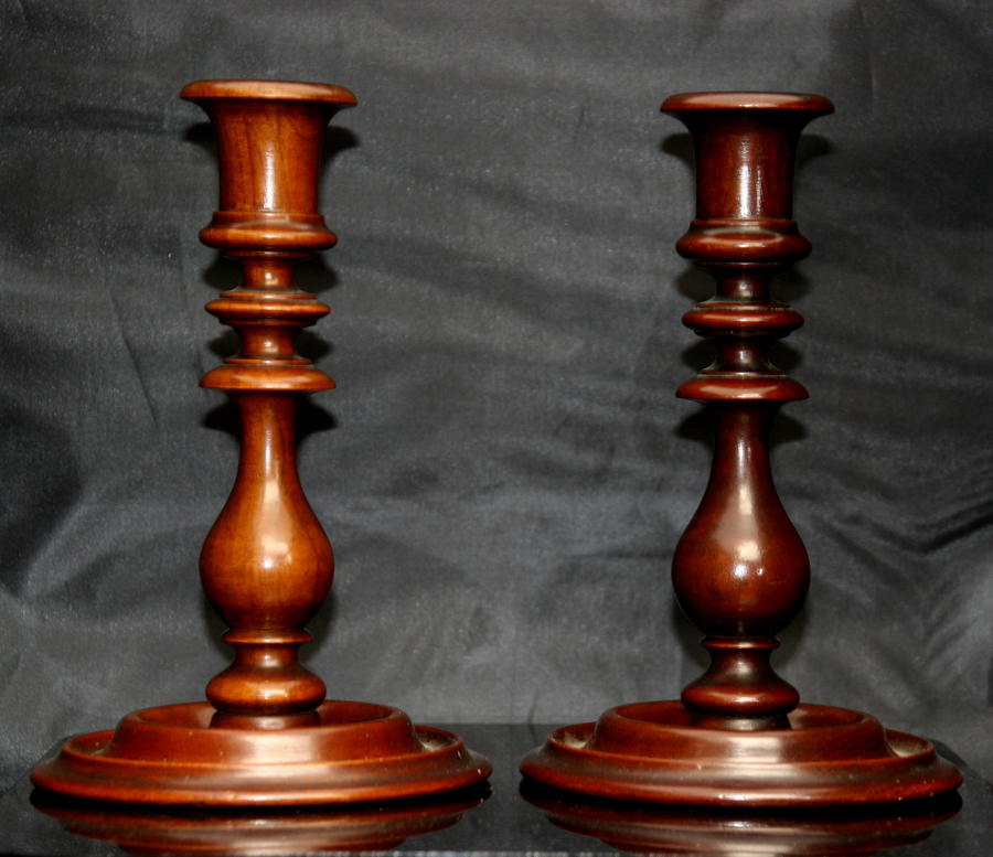 A Pair of Treen Candle sticks